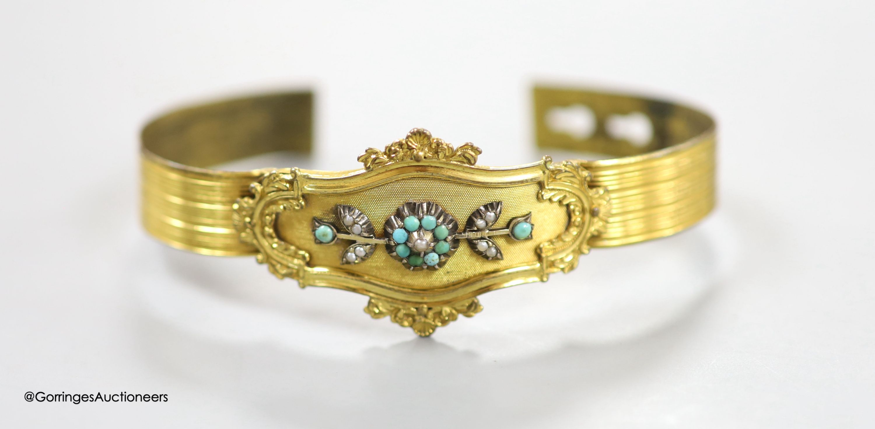 A Victorian pinchbeck, turquoise and seed pearl set hinged bracelet.